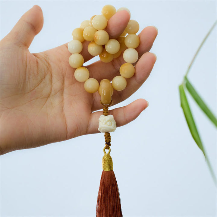 Buddha Stones Naturalne Nasiona Bodhi Kość Słoniowa Owoc Tańczący Lew Charm Harmonia Tassel Nadgarstek Mala