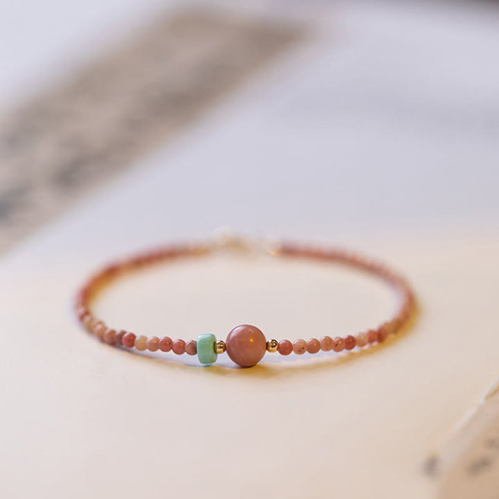 Bransoletka z naturalnego rodonitu i łańcuszka energetycznego z Buddha Stones 14K pozłacana