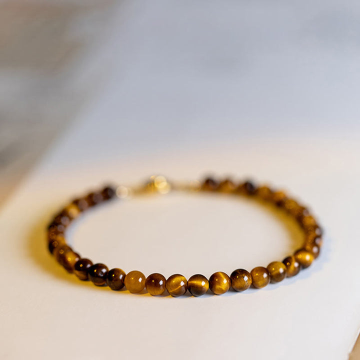 Bransoletka ochronna z Buddha Stones 14K pozłacane naturalne tygrysie oko z kamieniami odwagi