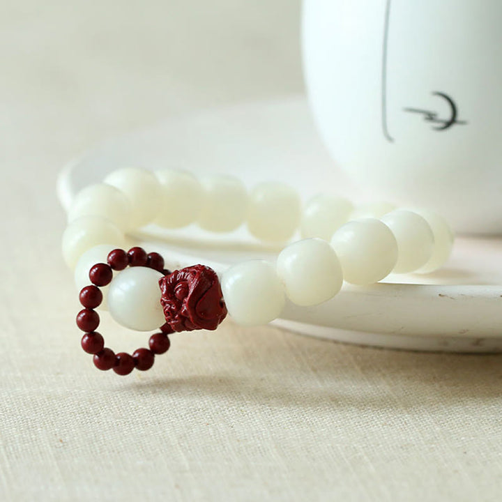 Buddha Stones Naturalne Nasiona Bodhi Cynober Tańczący Lew Charm Mądrość Harmonia Nadgarstek Mala