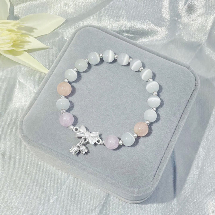Bransoletka z zawieszką w kształcie rozety z Buddha Stones , kociego oka i lawendowego ametystu