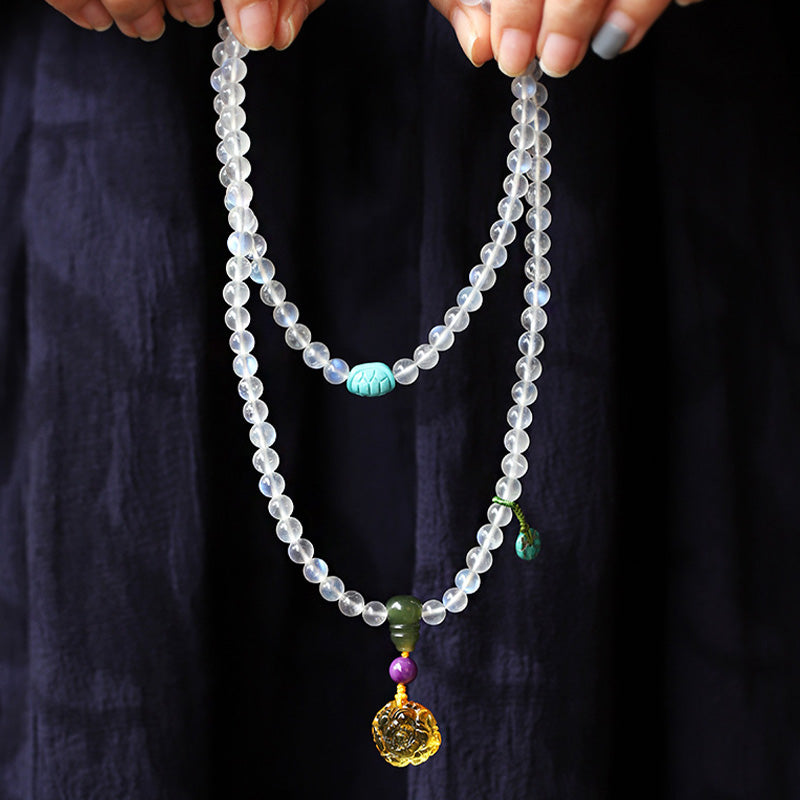 Buddha Stones 108 Mala Koraliki Kamień Księżycowy Bursztyn Lotos Turkus Kryształ Bransoletka Uzdrawiająca