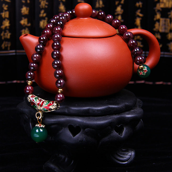 Bransoletka z naturalnego granatu i Buddha Stones
