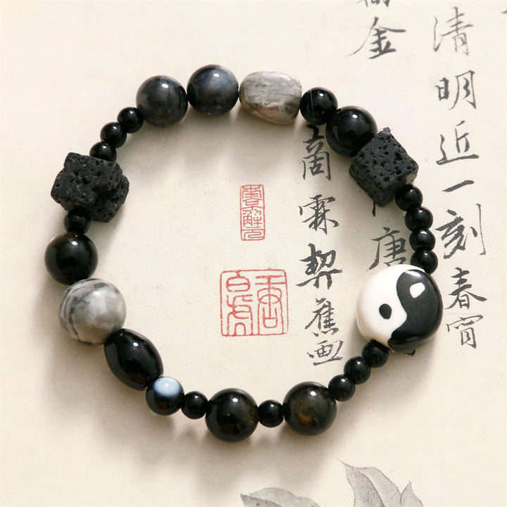 Bransoletka ochronna z Buddha Stones z czarnego onyksu i koralikami z jaspisu Picasso Yin Yang