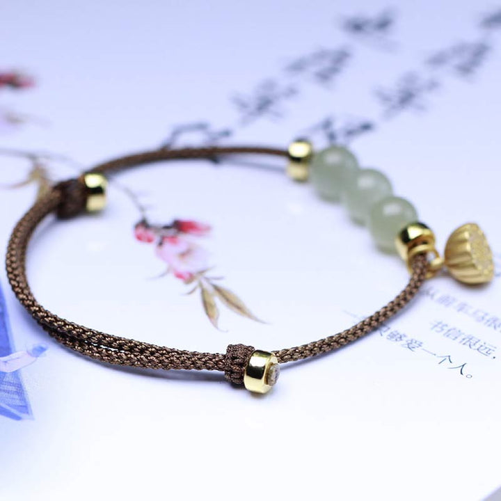 Bransoletka z naturalnego jadeitu i nasion lotosu z czerwonej nici Buddha Stones