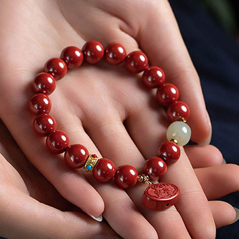 Bransoletka z zawieszkami ochronnymi z jadeitu i Buddha Stones