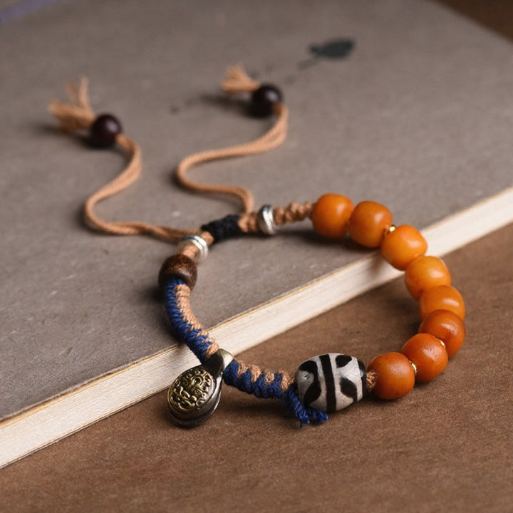 Buddha Stones Tybetańska bransoletka z koralikami Dzi z akcentem mosiężnym - image 2
