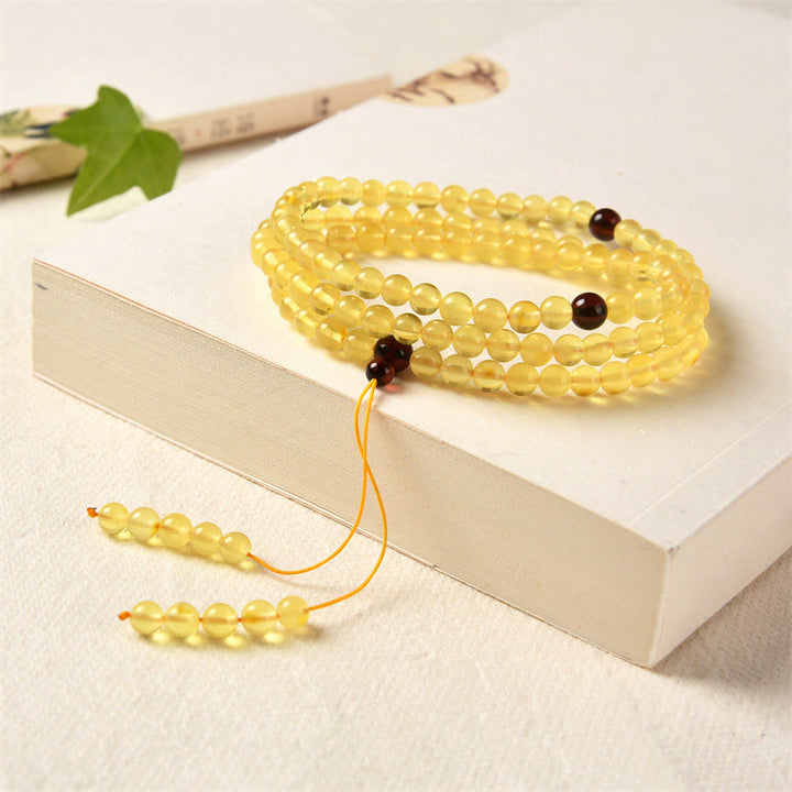 Buddha Stones 108 Mala Beads Naturalny Bursztyn Przezroczysta Bransoletka Antystresowa
