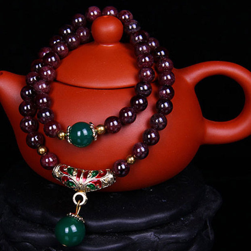 Bransoletka z naturalnego granatu i Buddha Stones