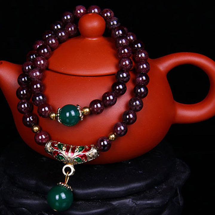 Bransoletka z naturalnego granatu i Buddha Stones
