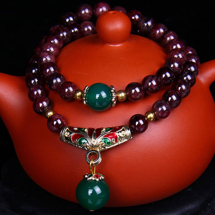 Bransoletka z naturalnego granatu i Buddha Stones