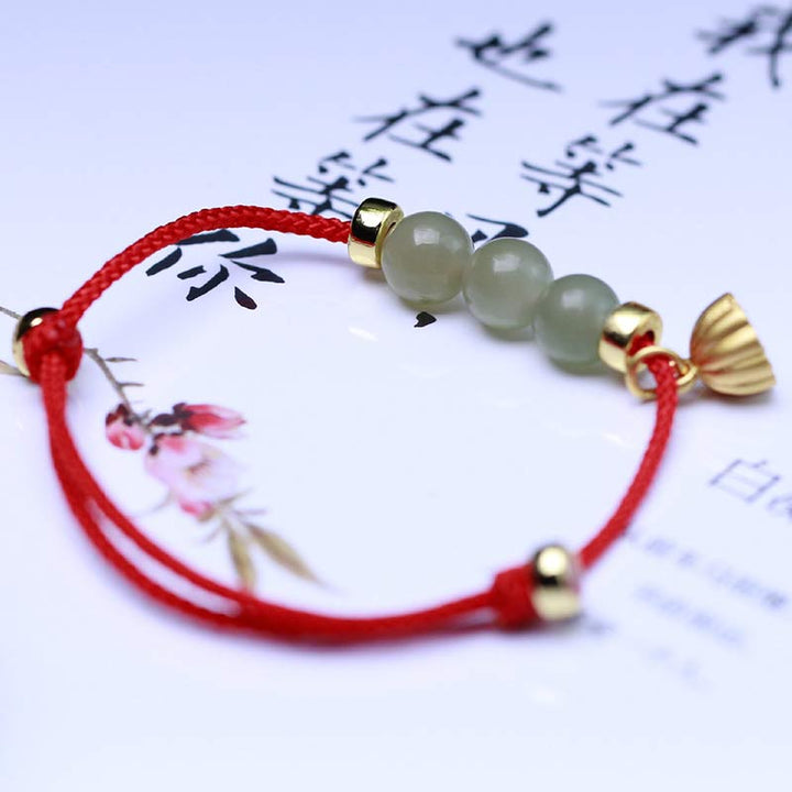 Bransoletka z naturalnego jadeitu i nasion lotosu z czerwonej nici Buddha Stones