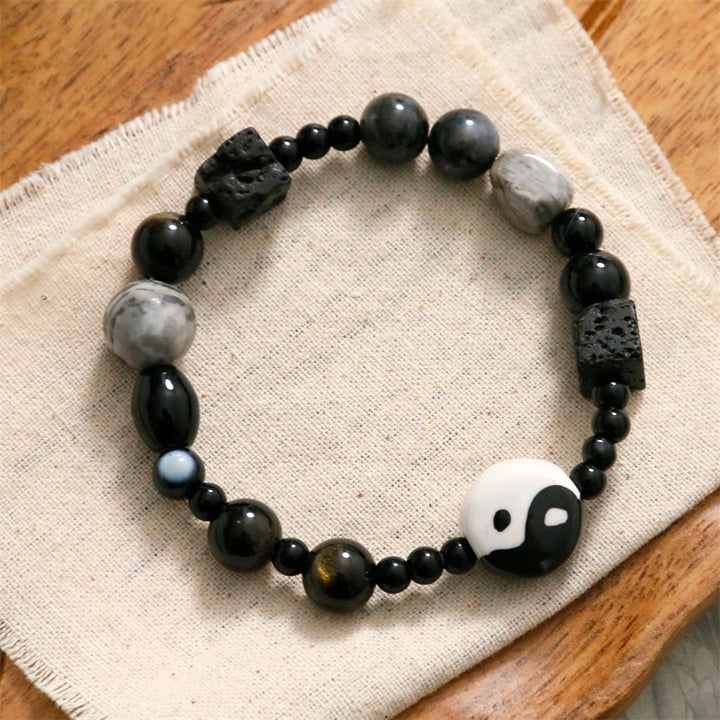 Bransoletka ochronna z Buddha Stones z czarnego onyksu i koralikami z jaspisu Picasso Yin Yang