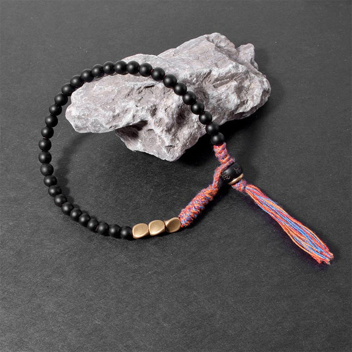 Bransoletka z frędzlami z Buddha Stones wykonana ręcznie z tybetańskiego czarnego onyksu