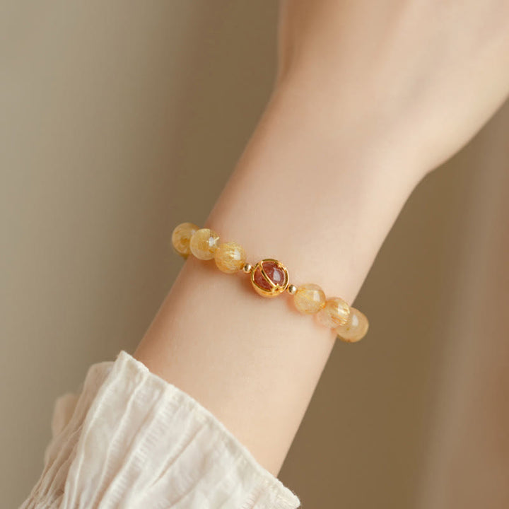 Bransoletka ochronna Buddha Stones Golden Rutilated Quartz i truskawkowy kwarc Star