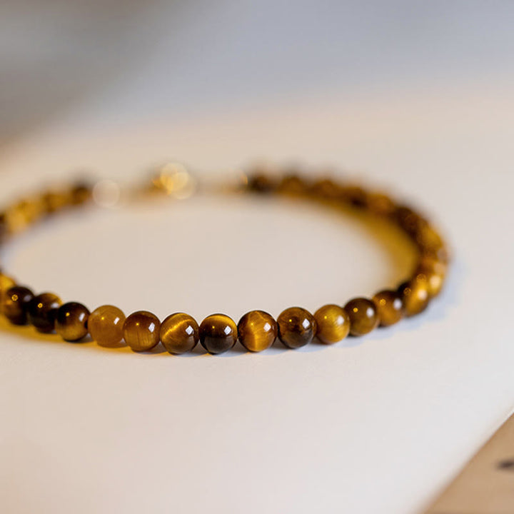 Bransoletka ochronna z Buddha Stones 14K pozłacane naturalne tygrysie oko z kamieniami odwagi