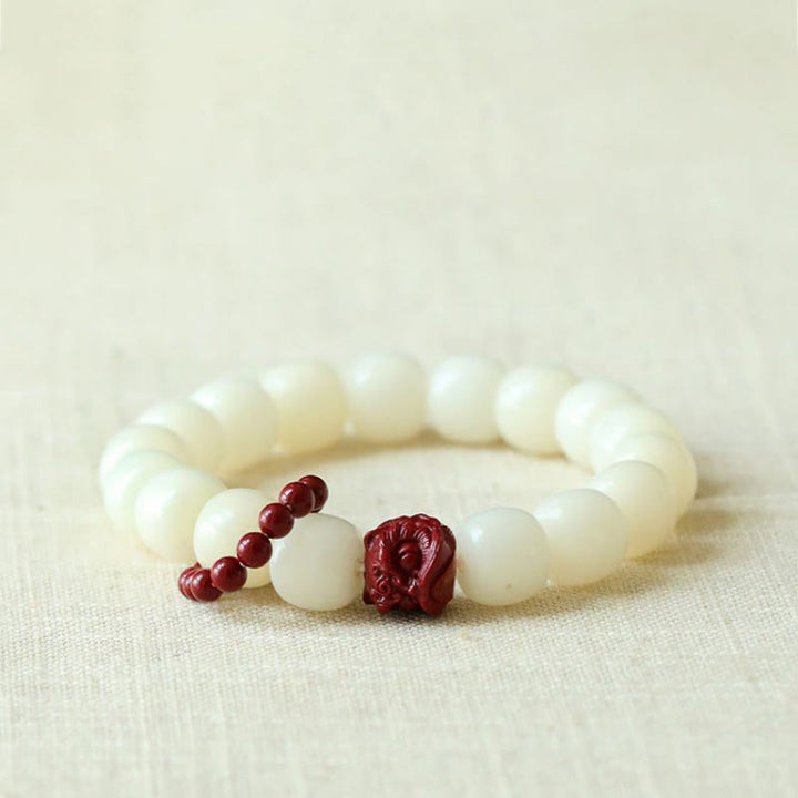 Buddha Stones Naturalne Nasiona Bodhi Cynober Tańczący Lew Charm Mądrość Harmonia Nadgarstek Mala