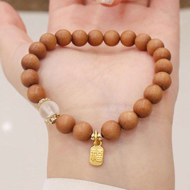 Bransoletka ochronna z Buddha Stones, sandałowym drzewem i kocim okiem Fu Character Charm