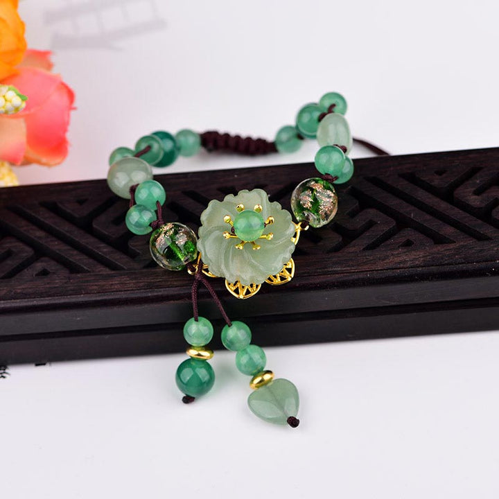 Bransoletka z naturalnego zielonego jadeitu z kwiatami szczęścia i Buddha Stones