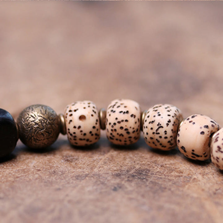 Buddha Stones Tybetańskie Nasiona Bodhi Czarny Obsydian Drewno Hebanowe Miedź Bransoletka Spokoju