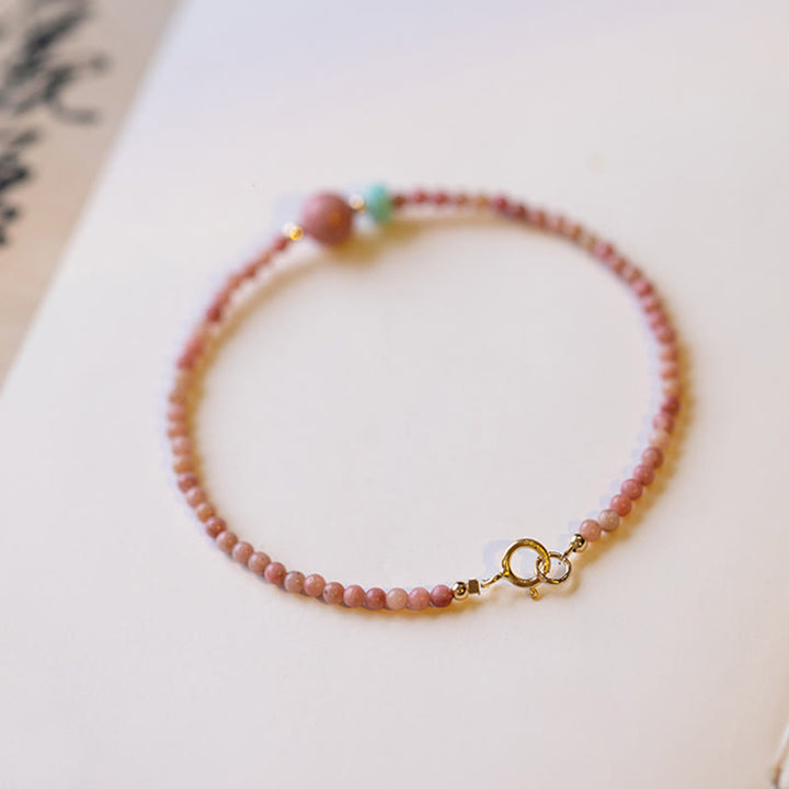 Bransoletka z naturalnego rodonitu i łańcuszka energetycznego z Buddha Stones 14K pozłacana