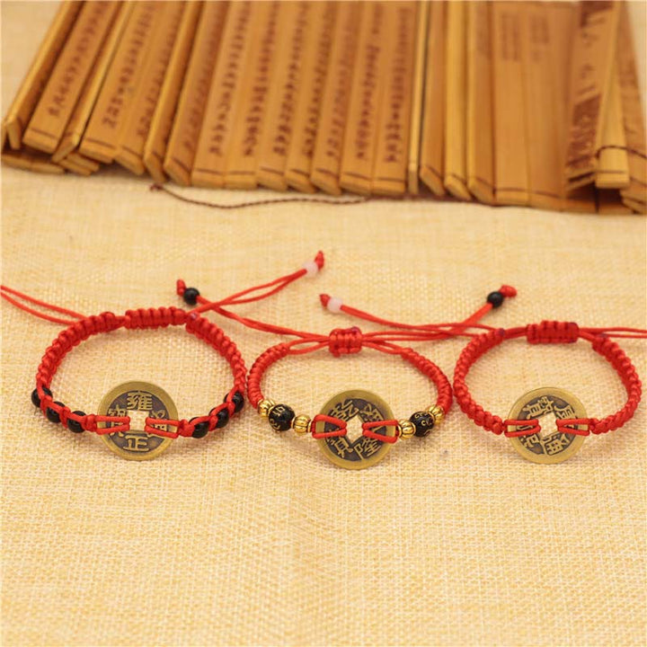 Bransoletka z czerwonego sznurka z miedzianymi monetami Buddha Stones