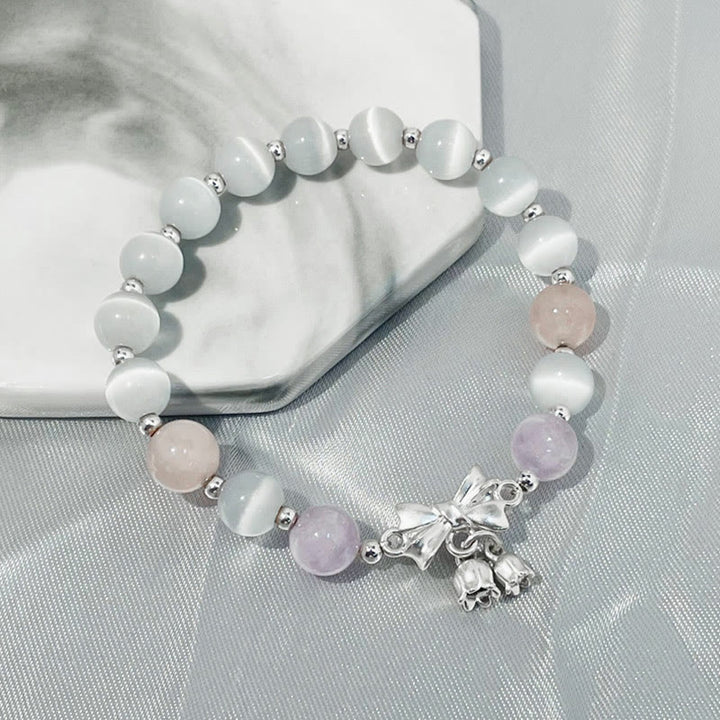Bransoletka z zawieszką w kształcie rozety z Buddha Stones , kociego oka i lawendowego ametystu
