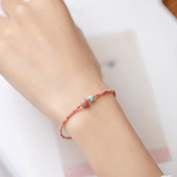 Bransoletka z naturalnego rodonitu i łańcuszka energetycznego z Buddha Stones 14K pozłacana