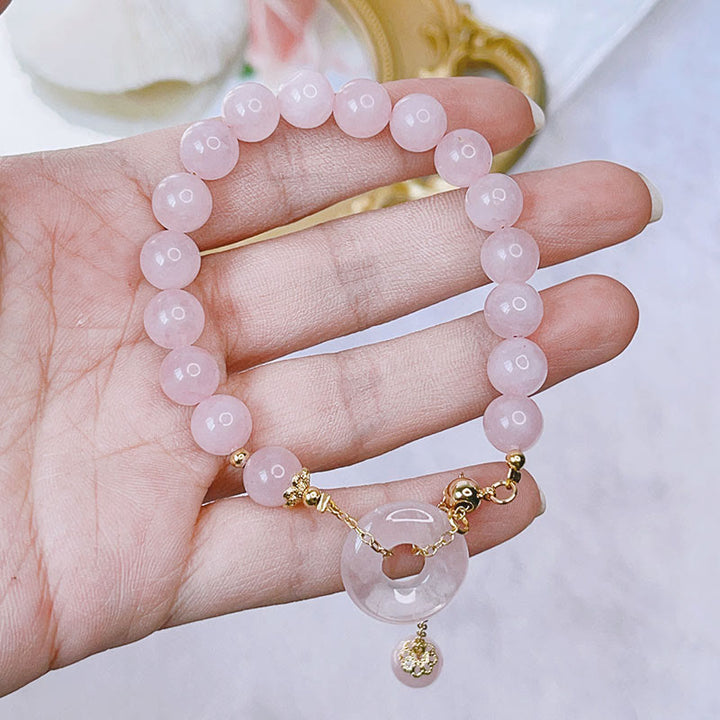 Bransoletka z naturalnego różowego kryształu Buddha Stones z klamrą i zawieszką Love Charm