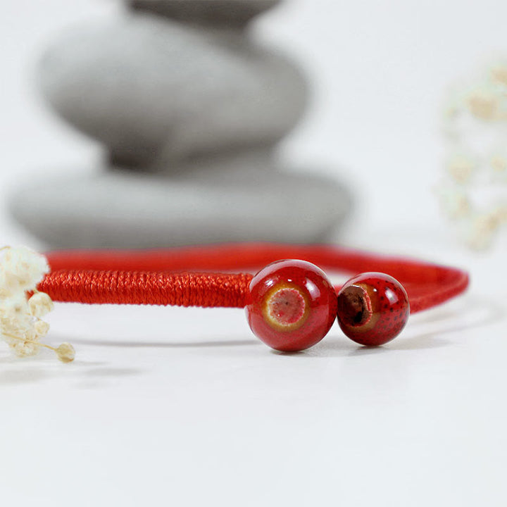 Bransoletka ceramiczna z czerwonymi sznurkami i Buddha Stones FengShui - image 3
