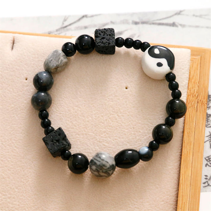 Bransoletka ochronna z Buddha Stones z czarnego onyksu i koralikami z jaspisu Picasso Yin Yang