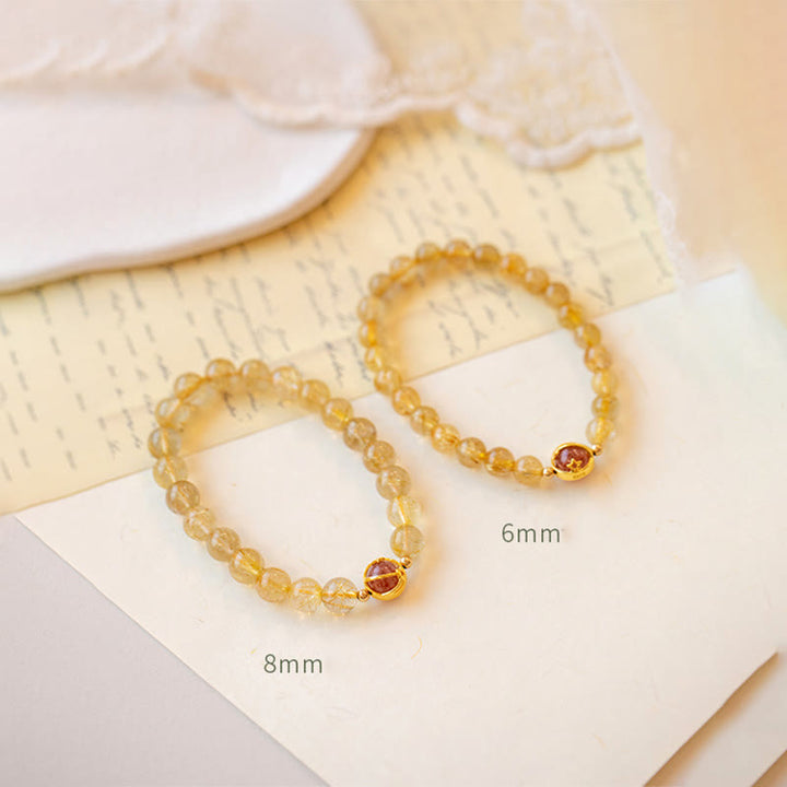 Bransoletka ochronna Buddha Stones Golden Rutilated Quartz i truskawkowy kwarc Star
