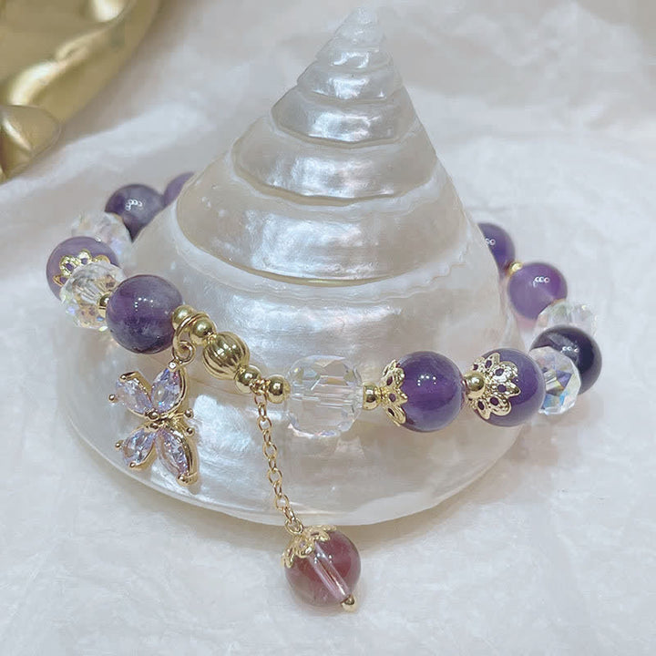 Bransoletka z naturalnym kryształem ametystu i zawieszką motyla Buddha Stones