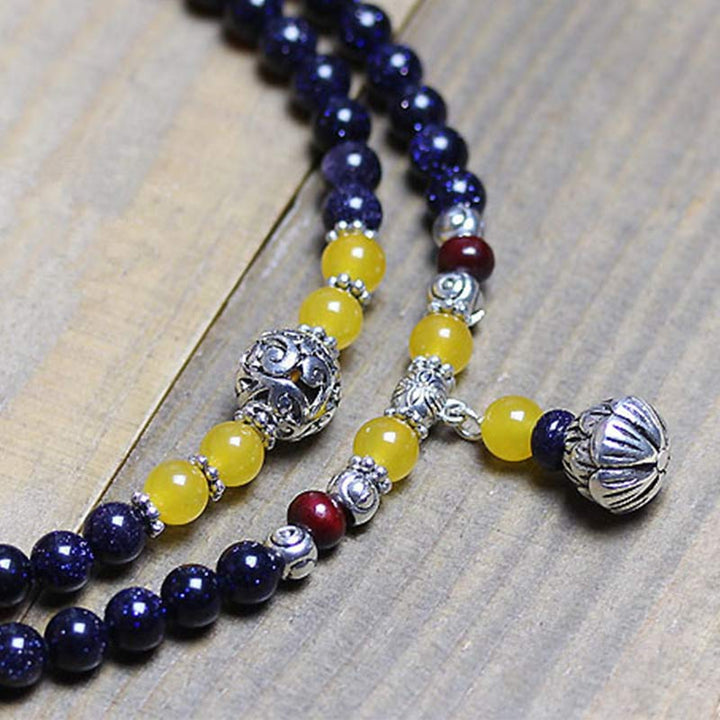 Bransoletka z zawieszkami bogactwa z niebieskiego piaskowca i Buddha Stones Mala