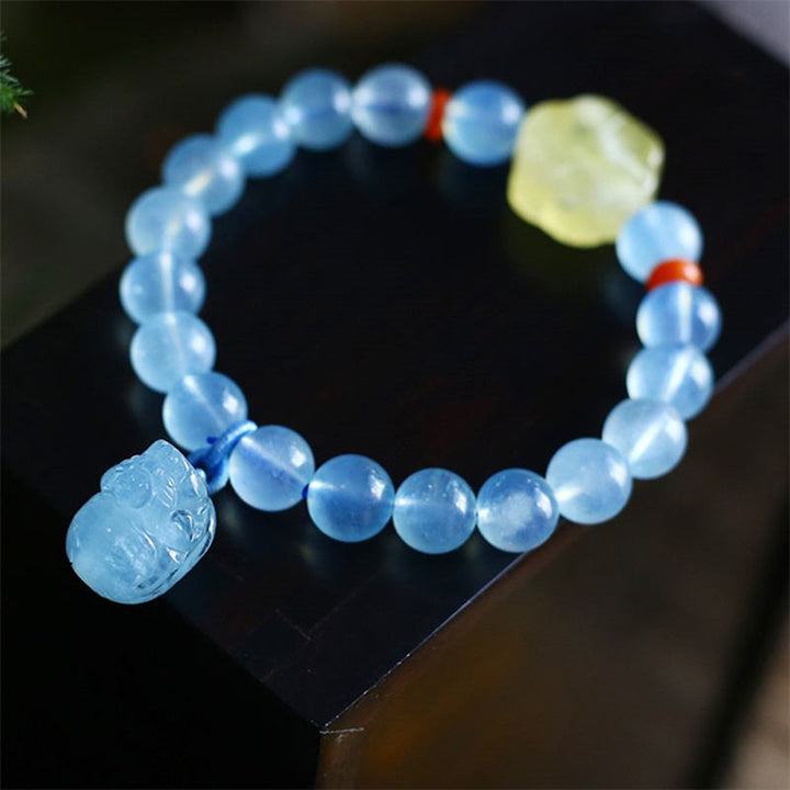 Bransoletka z naturalnego bursztynu i akwamarynu PiXiu Peace Healing Charm
