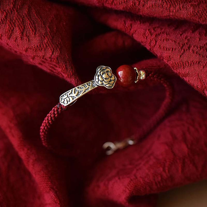 Bransoletka z Buddha Stones ze srebra próby 925 i sznurka błogosławieństwa z cynobrem